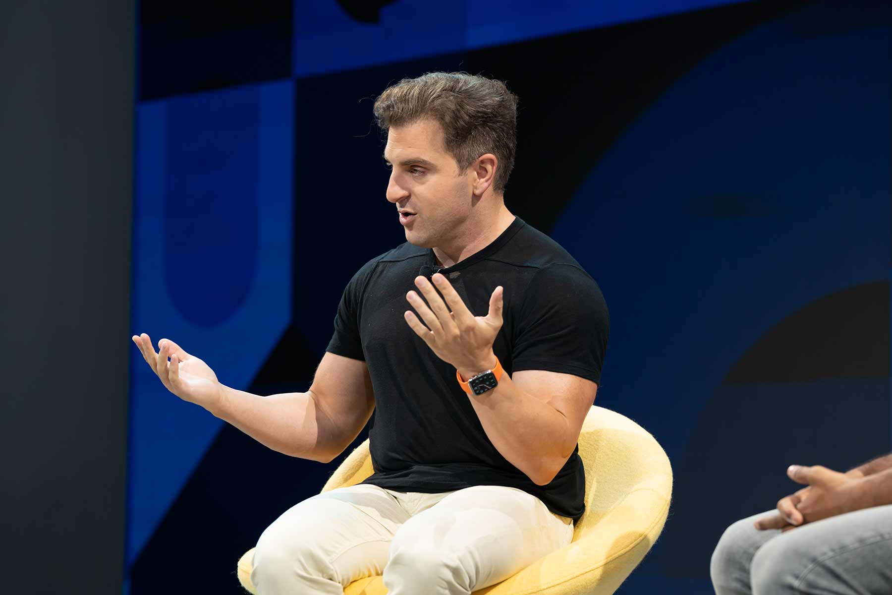 Airbnb CEO Brian Chesky speaking at Skift Global Forum in 2022. 