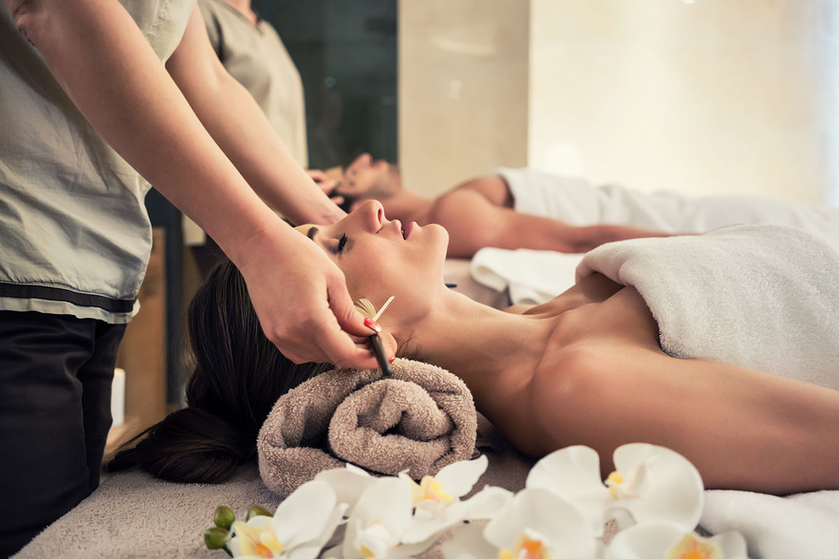 Guests at a spa receiving wellness treatments. 